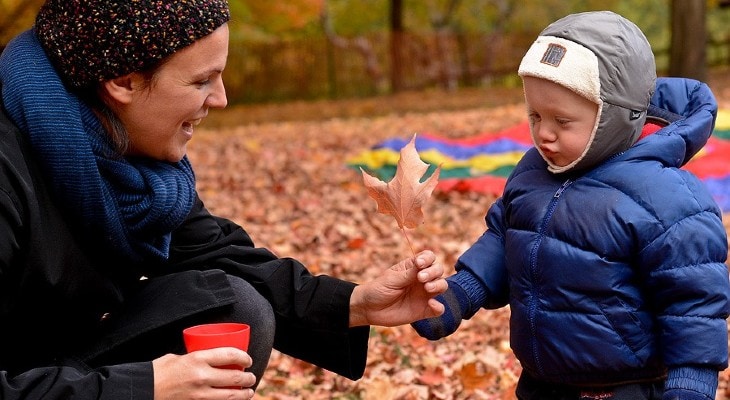 mother and child outdoors in the park in fall