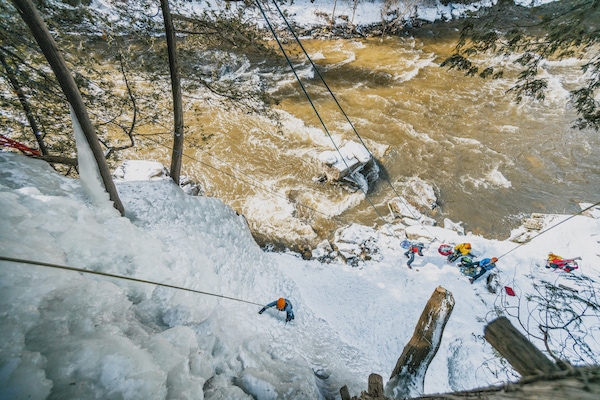 Image from above of group ice climbing