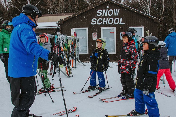 kids listening to ski instructor at Brimacombe Snow School