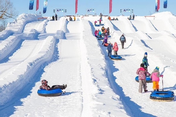 Kids snow tubing at Winterlude festival in Ottawa