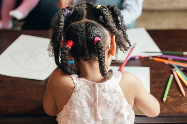 girl drawing viewed from behind